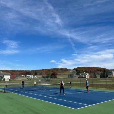 Access to Pickleball and Tennis courts. Playing pickleball doubles.